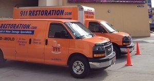 Snow Storm Damage Vans At Headquarters